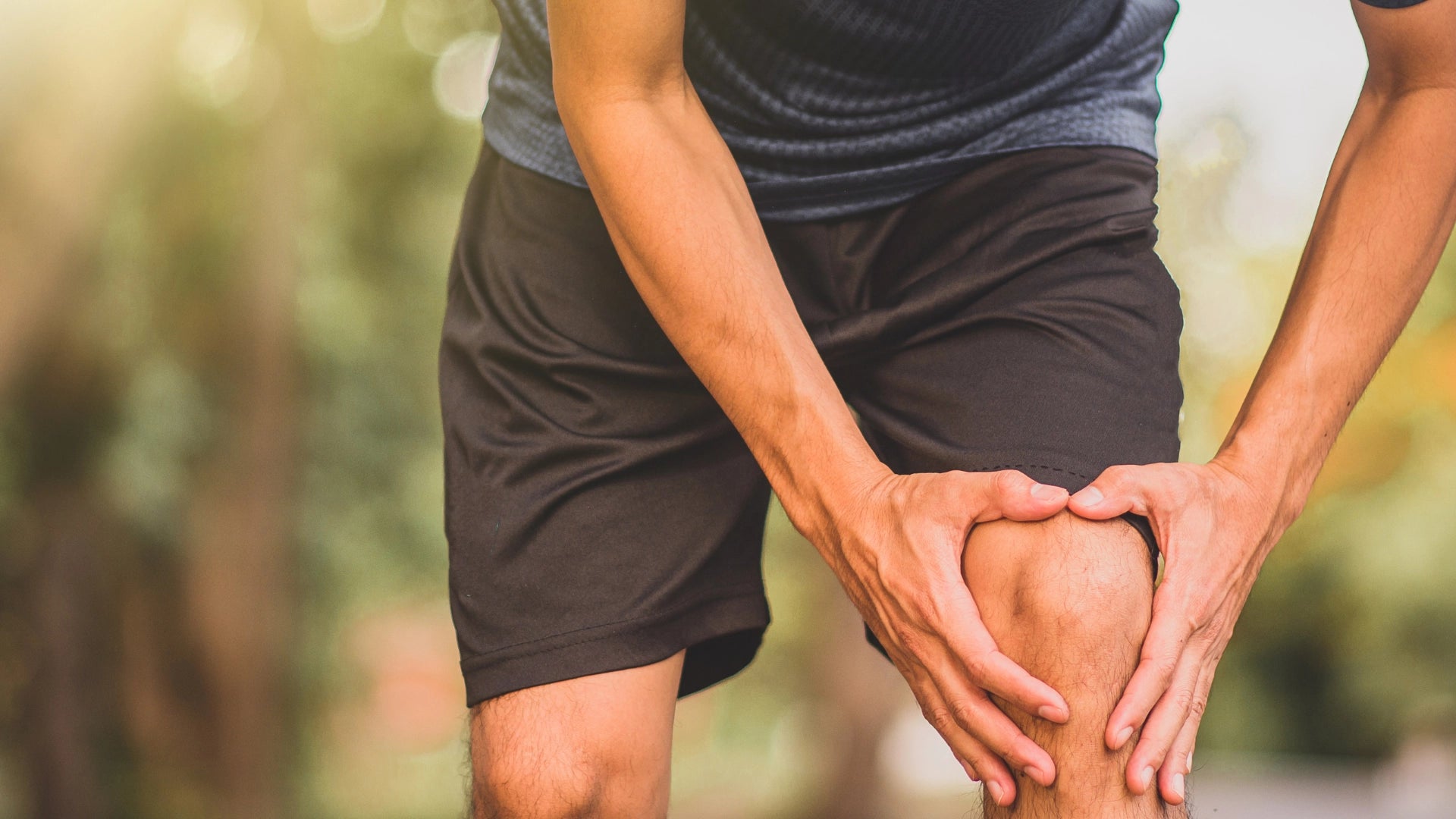 A man holding his knees