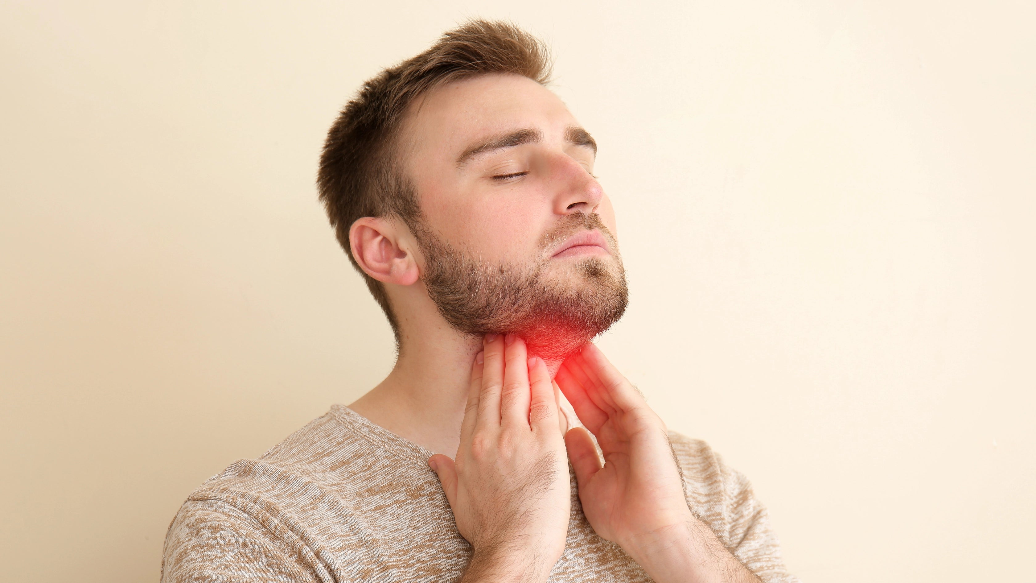 Young Man Checking Thyroid Gland