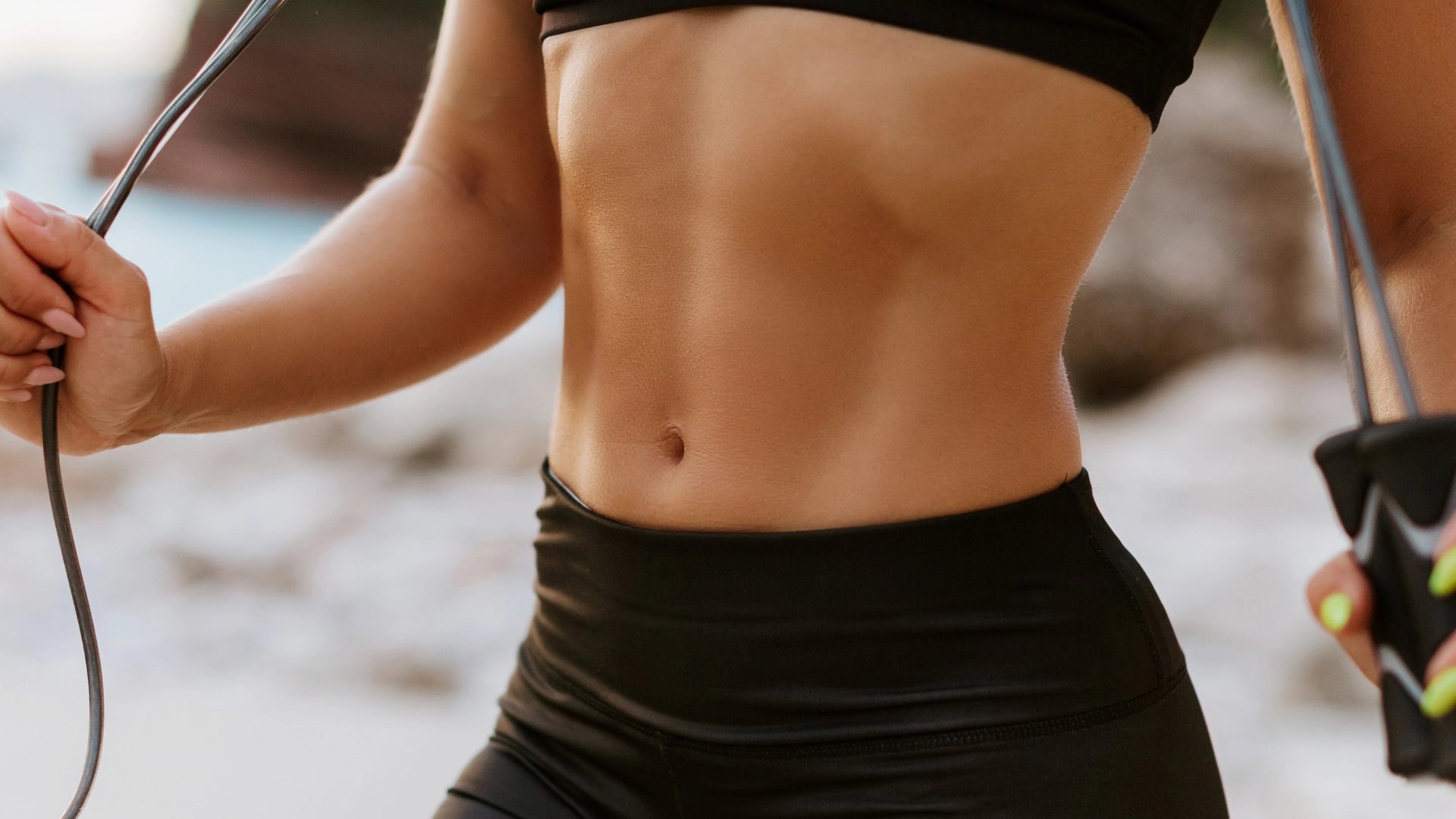 An image of a fit young woman with toned abdominal muscles